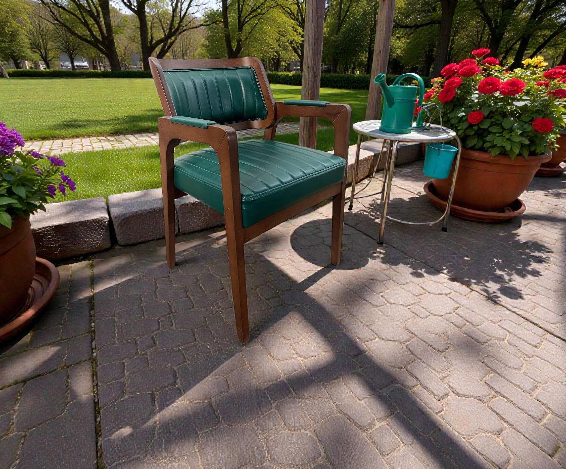WISH armchair on a garden patio beside potted flowers and a side table