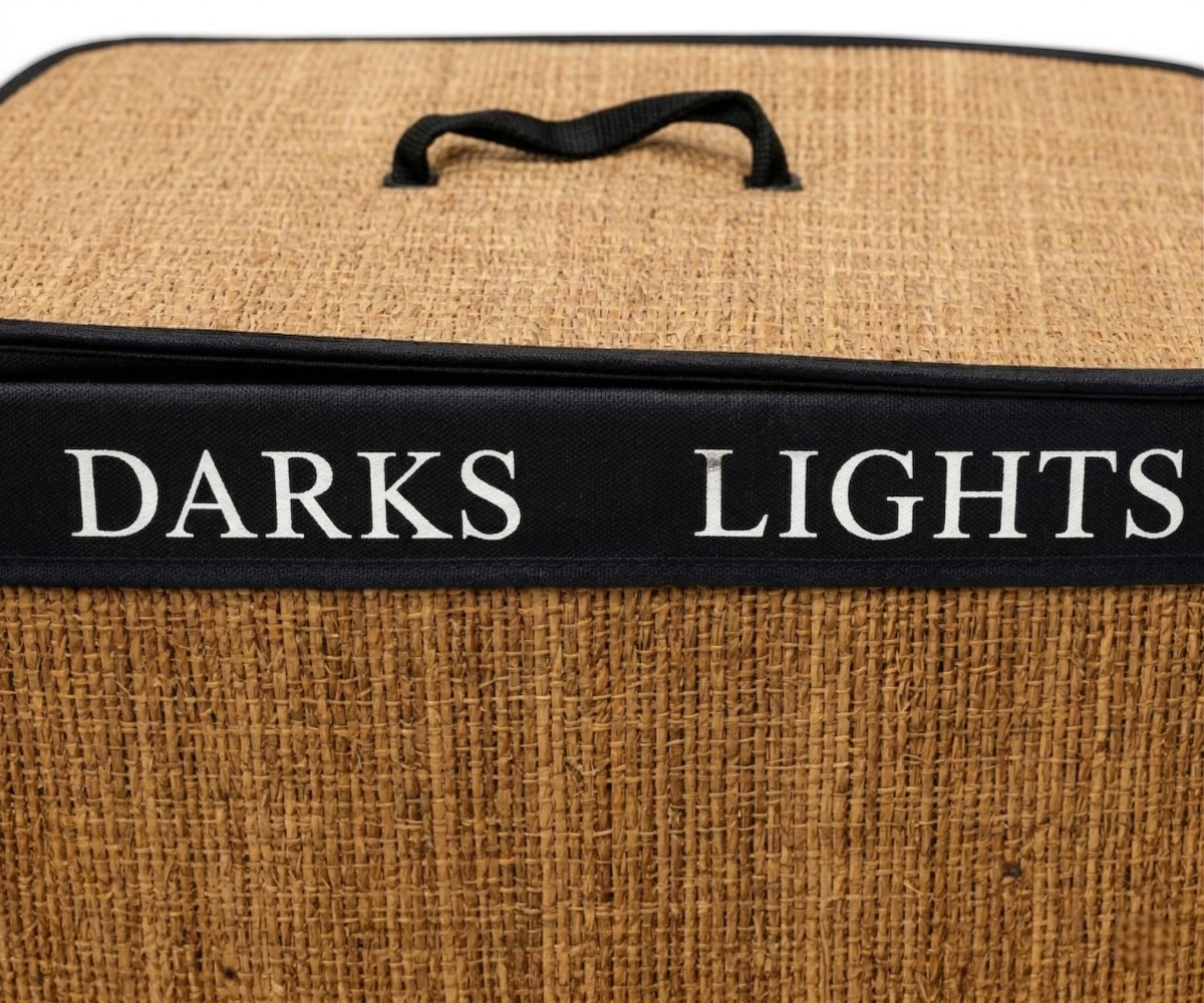 Woven laundry organizer basket with a lid, labelled Darks and Lights