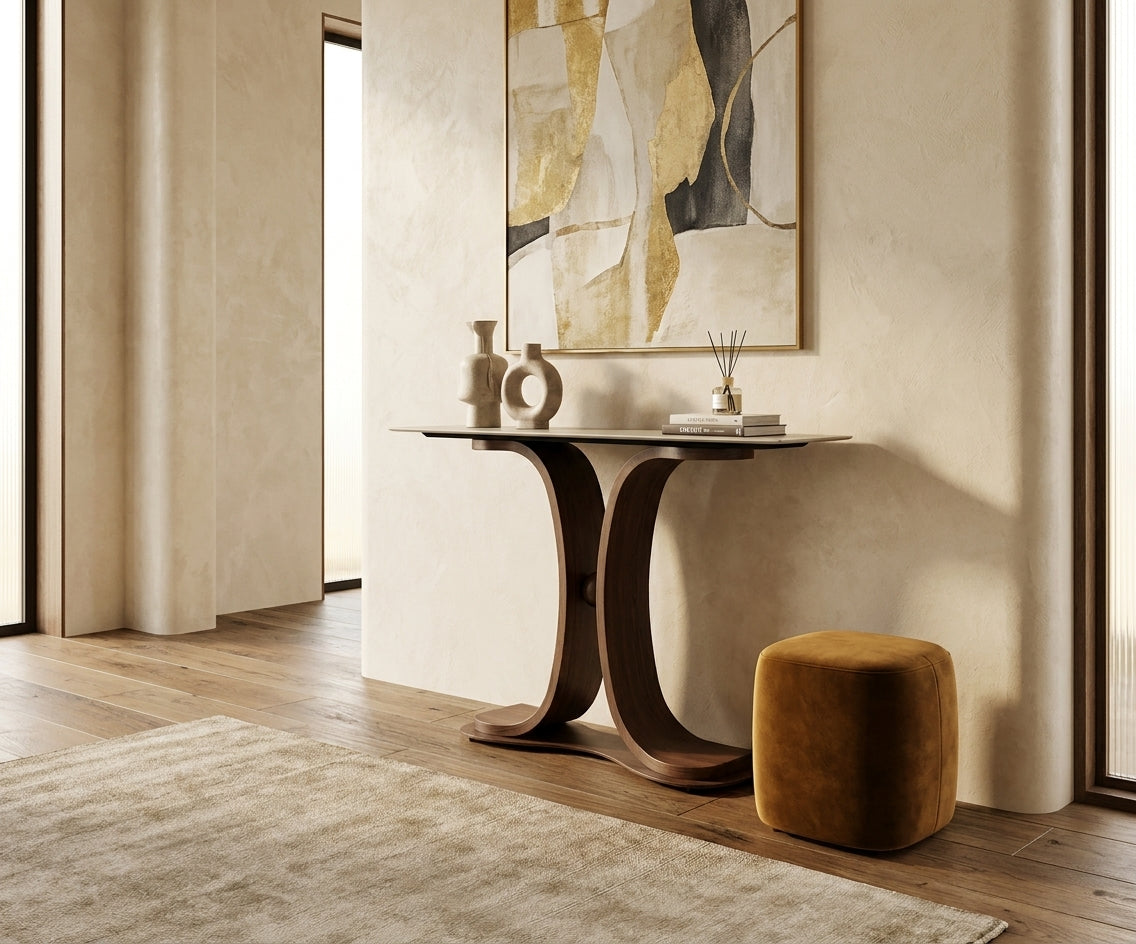 Y32#,34# curved wood console beneath artwork beside an ochre stool