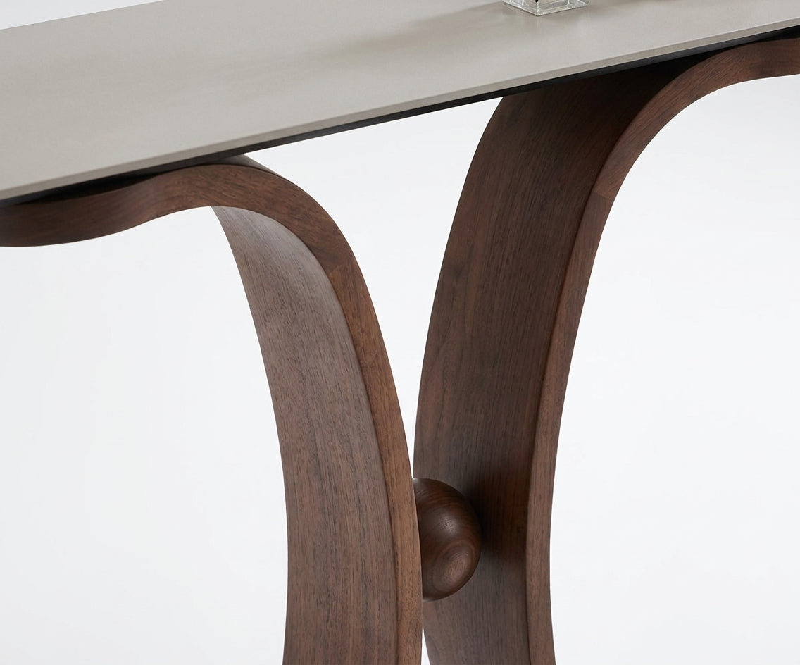 Y32#,34# curved wood console beneath artwork beside an ochre stool