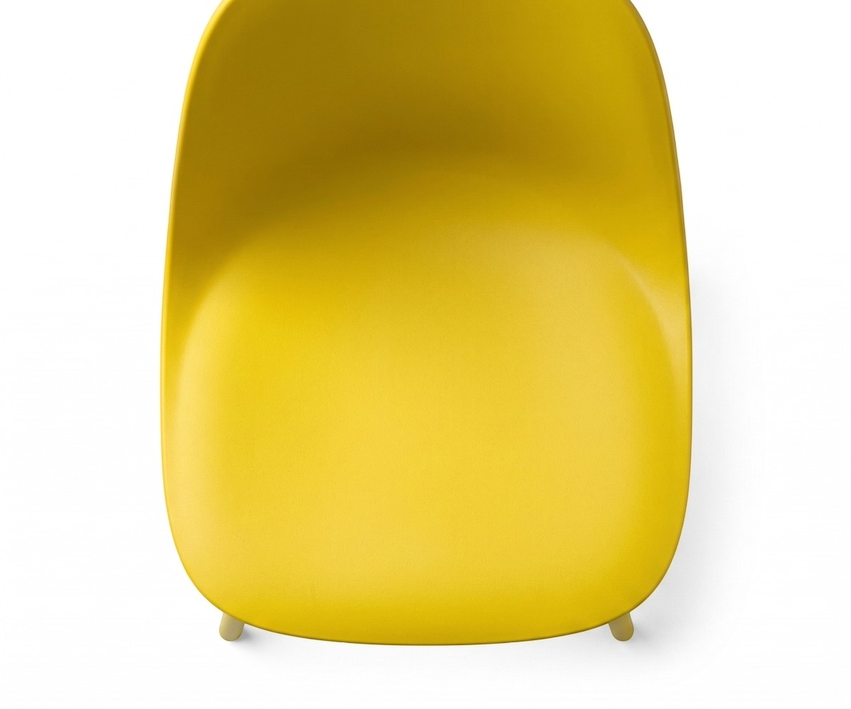 Yellow modern plastic dining chair, angled view of its moulded shell
